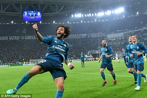 Marcelo và đồng đội ăn mừng bàn thắng thứ 3 của Real vào lưới Juventus (Ảnh: AFP). ronaldo ruc sang real thang 3 sao truoc juventus