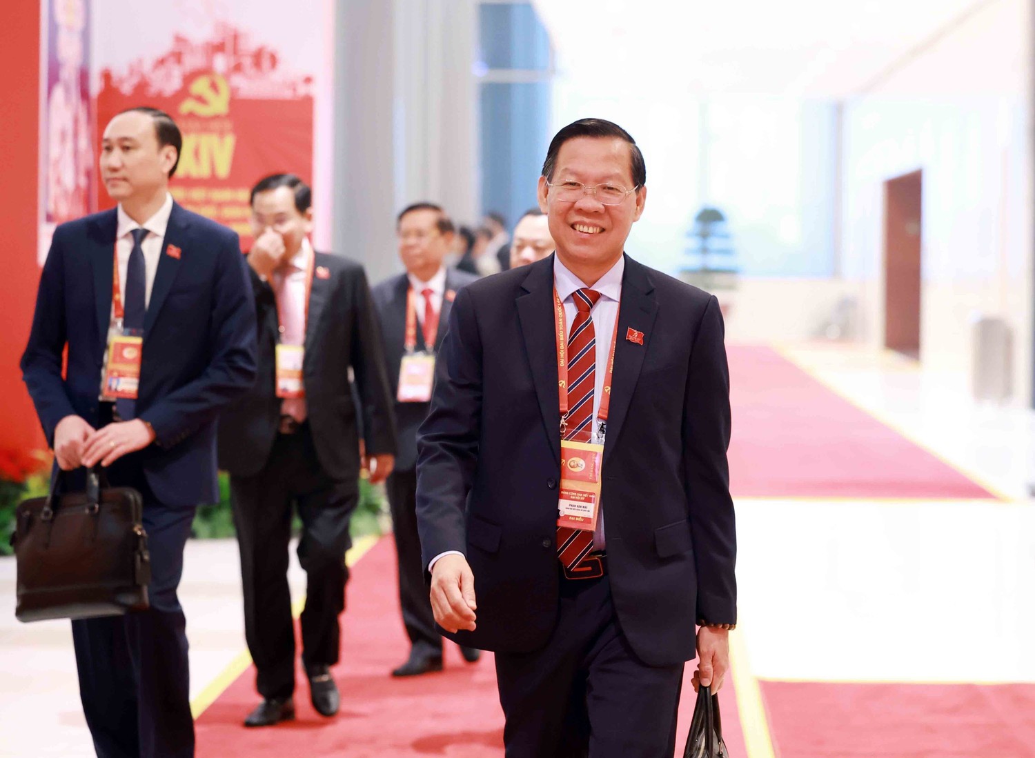 Các đại biểu đến dự Đại hội XIV của Đảng. Ảnh: TTXVN