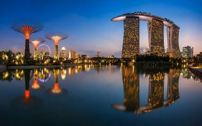 Đảo quốc Singapore có nhiều điểm đến hấp dẫn như công viên Merlion, vương quốc côn trùng, cảng cầu Clarke, nhà hát Esplanade trên vịnh... thu hút rất nhiều khách du lịch hàng năm. Ảnh: Marina Bay Sands. nhung diem du lich tuyet voi o chau a cho dip tet am lich
