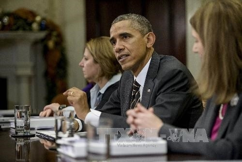 Tổng thống Mỹ Barack Obama (giữa) trong buổi họp báo trước cuộc họp tại Nhà Trắng ngày 12/12. Ảnh: AFP/ TTXVN