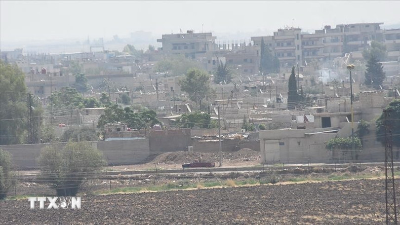 Khói bốc lên trong cuộc giao tranh tại Syria. (Ảnh: AA/TTXVN) Khói bốc lên trong cuộc giao tranh tại Syria. (Ảnh: AA/TTXVN)