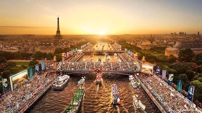 Những chiếc thuyển chở các đoàn thể thao sẽ diễu hành trên dòng sông Seine.