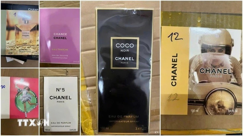 Các loại nước hoa giả bị phát hiện. (Ảnh: Cơ quan công an cung cấp) ttxvn-nuoc-hoa-gia-1jpg.jpg