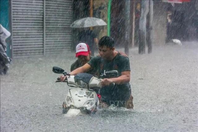 Cảnh ngập lụt sau những trận mưa lớn do ảnh hưởng của bão Gaemi tại Quezon, Philippines, ngày 24/7. (Ảnh: THX/TTXVN) Cảnh ngập lụt sau những trận mưa lớn do ảnh hưởng của bão Gaemi tại Quezon, Philippines, ngày 24/7. (Ảnh: THX/TTXVN)