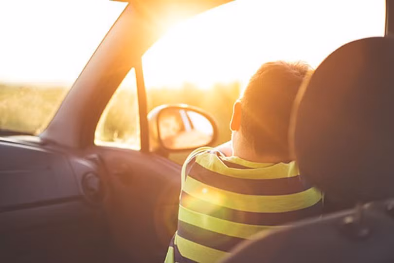 child-in-car-with-sun-shining-1565152287795395137366.jpg
