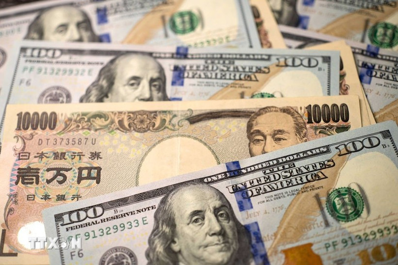 Đồng USD và đồng yen tại Tokyo, Nhật Bản. (Ảnh: THX/TTXVN) dong-yen-usd-0807.jpg