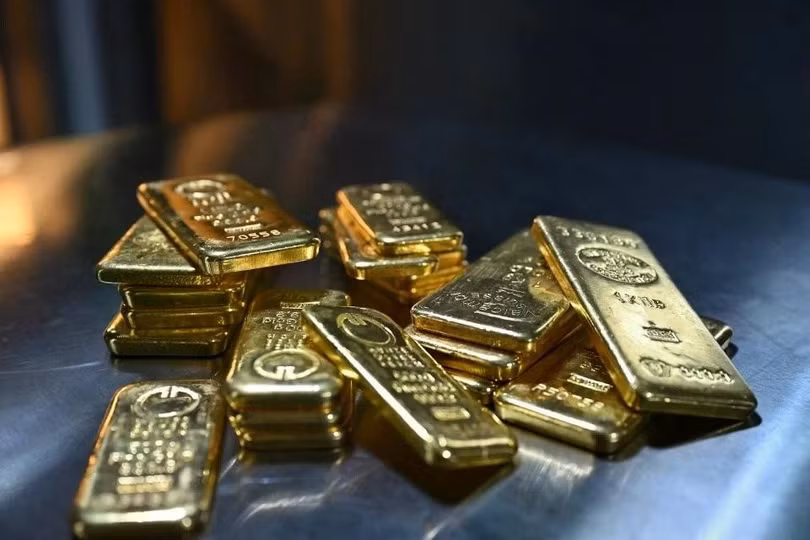 Trong phiên giao dịch 28/1 (giờ Mỹ), giá vàng thế giới lập đỉnh mới ở mốc 5.611 USD/ounce. Ảnh: Reuters.
