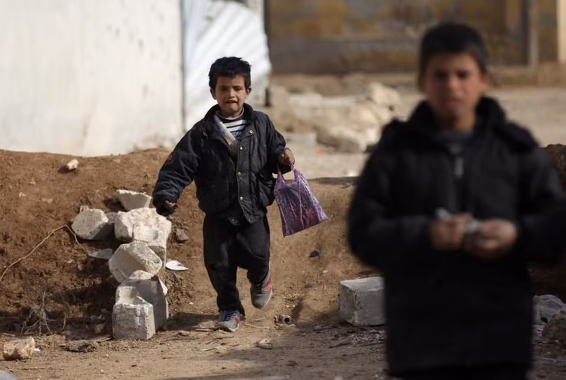 photo is thao chay tre em syria quay tro lai truong