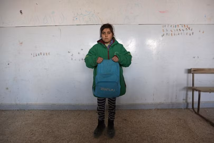 photo is thao chay tre em syria quay tro lai truong