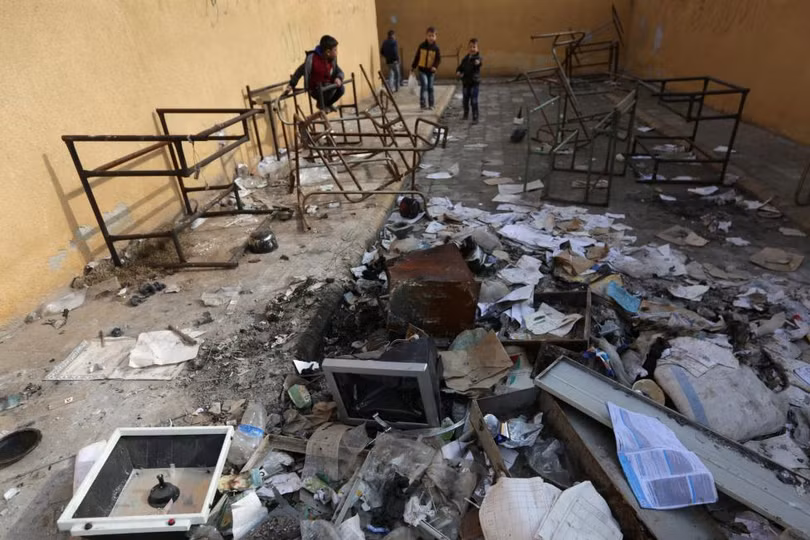 photo is thao chay tre em syria quay tro lai truong