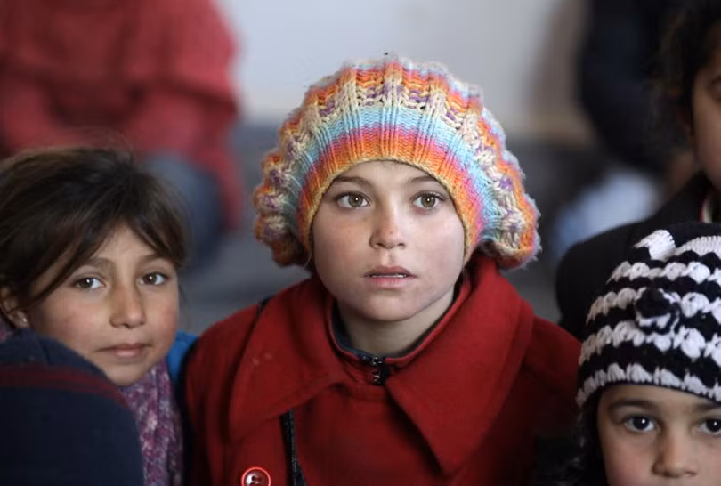 photo is thao chay tre em syria quay tro lai truong