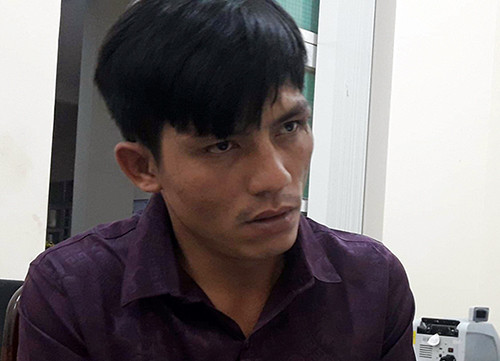 Hoàng Nam tại cơ quan điều tra. Ảnh: Thái Hà. Hai nghi can cướp trạm thu phí bị bắt khi lên tàu ra Bắc