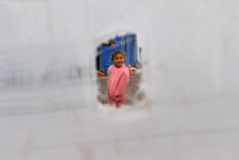 photo nguoi dan iraq bo nha cua thao chay khoi vung chien su